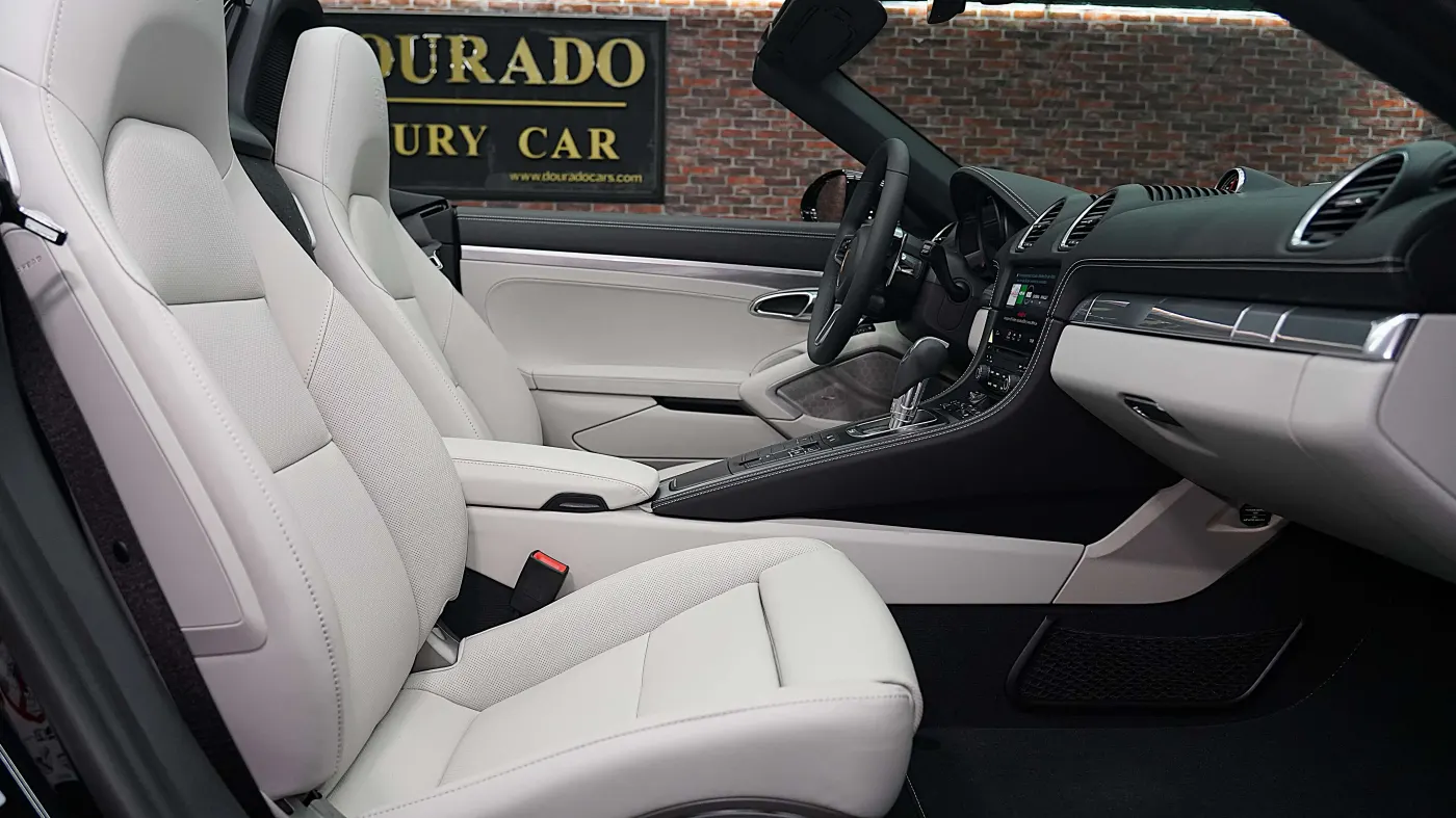 Experience Porsche 718 Boxster with agile handling and open-top design